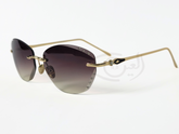 Women's Rimless Sunglasses. The sunglasses feature a gradient lens, gold-toned frame, and embellishments.