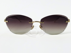 Women's Rimless Sunglasses. The sunglasses feature a gradient lens, gold-toned frame, and embellishments.