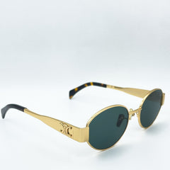 Celine sunglasses with a gold frame and dark lenses.100% UV protection .