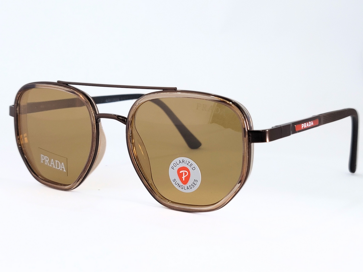 **Prada Polarized Sunglasses**  
Bold aviator-style frame with brown polarized lenses . Stylish, sleek, and perfect for everyday wear.