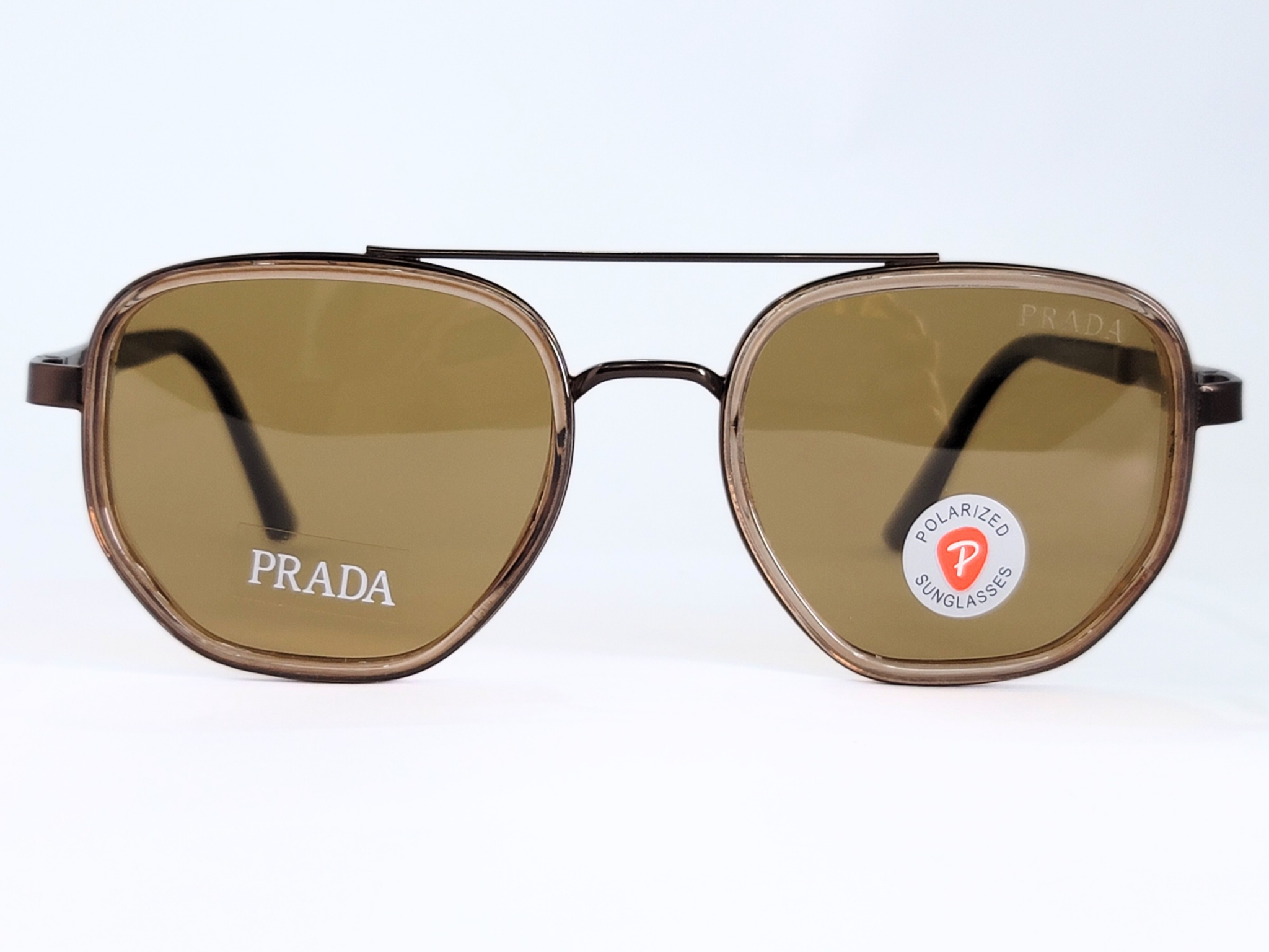 **Prada Polarized Sunglasses**  
Bold aviator-style frame with brown polarized lenses . Stylish, sleek, and perfect for everyday wear.