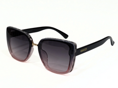 Gucci Black Square Sunglasses with Gradient Lenses and Gold Accents.