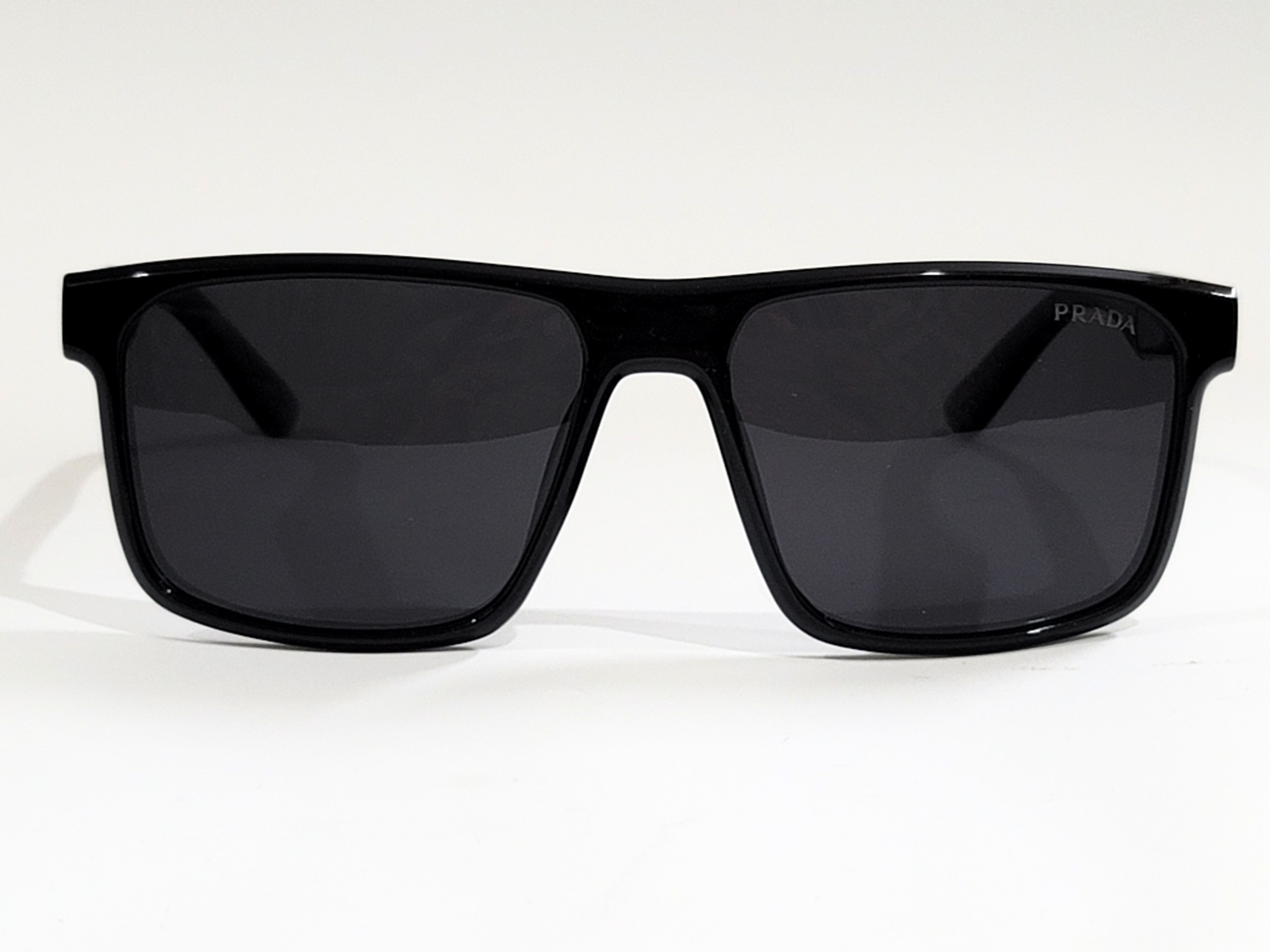 Prada Matte Black Rectangular Sunglasses with Brown Polarized Lenses