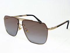 Gucci Square Aviator Sunglasses With Gold Frame and Gradient Lenses.
